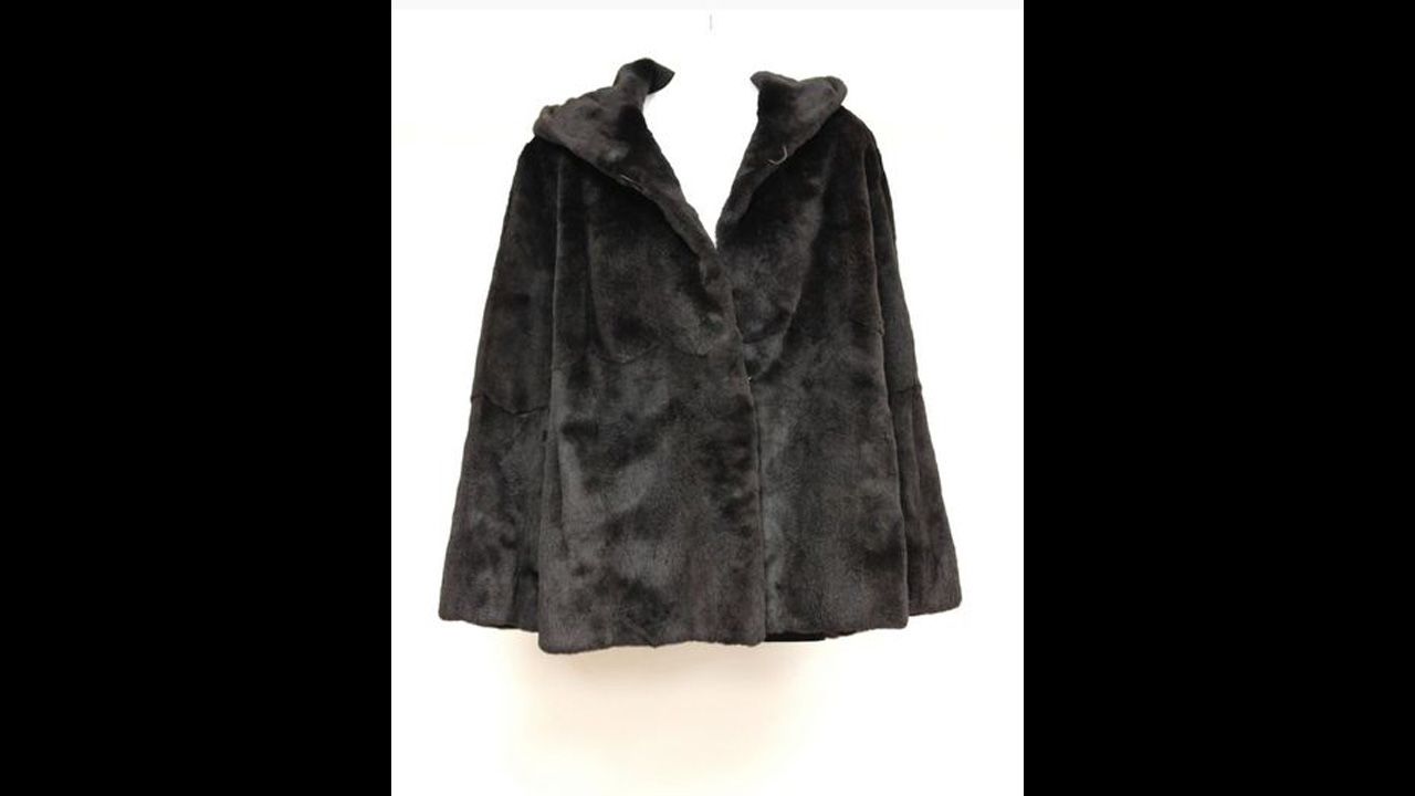 Black sheared mink hooded parka with vertical sections of mink, full-length sleeves. 