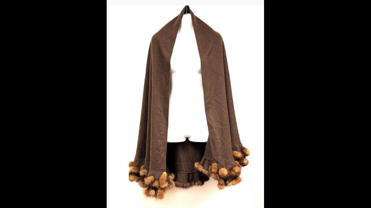 Brown cashmere cape with brown mink double-edge trim. 