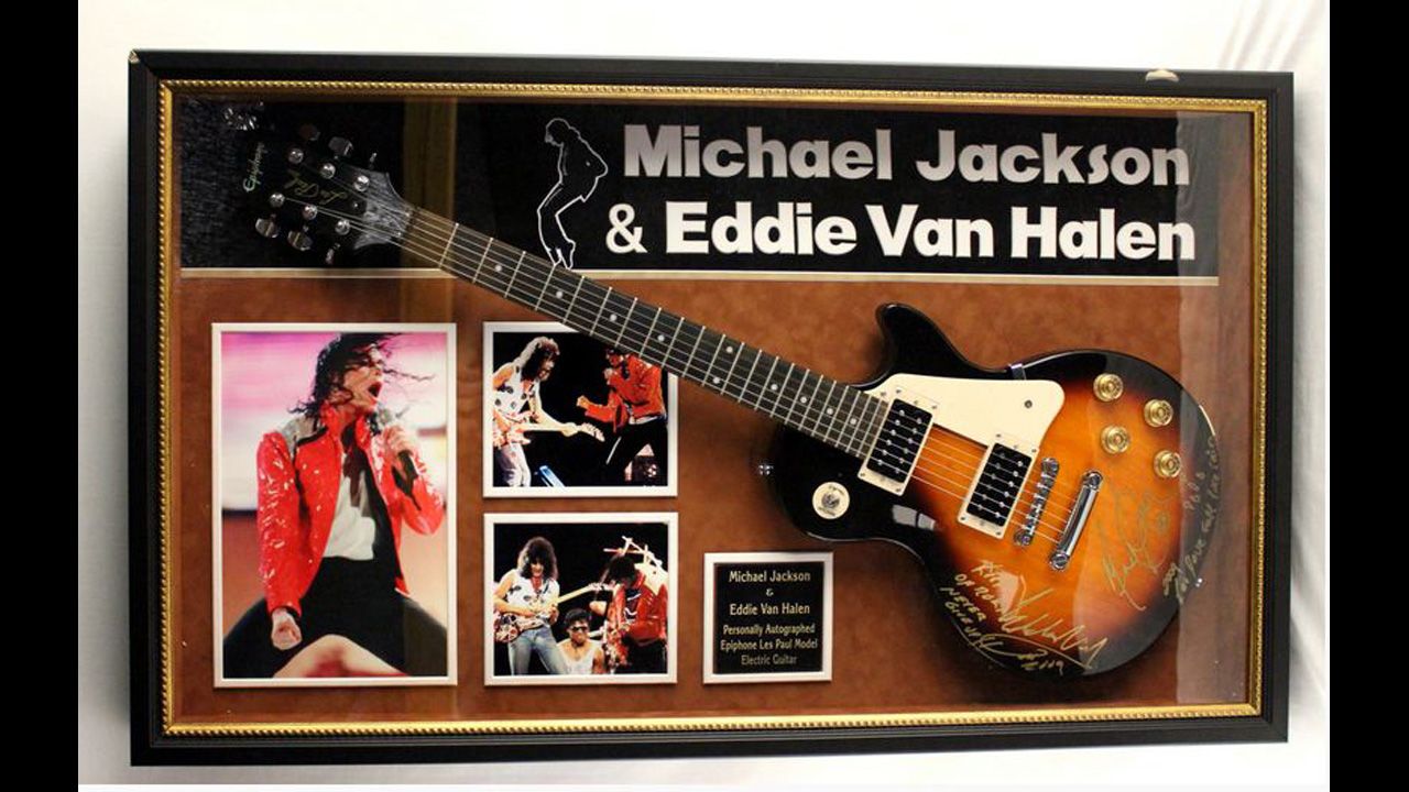 Framed and matted Epiphone guitar, autographed "Michael Jackson" and "Eddie Van Halen."  Those signatures may be fake, according to the U.S. Marshals Service, which said it had received "legitimate concerns about the authenticity" of the guitar.