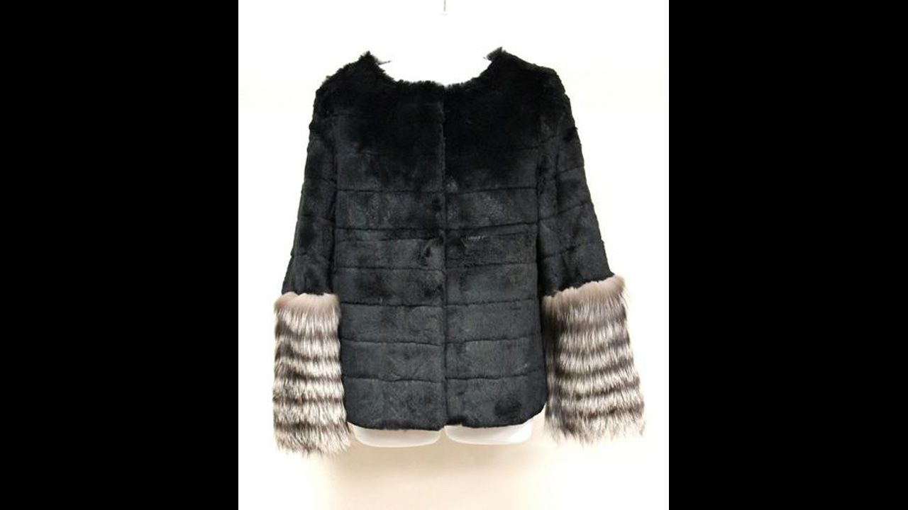 Black sheared mink jacket with 40% silver fox sleeves, horizontal strips of mink and 3/4-length sleeves.