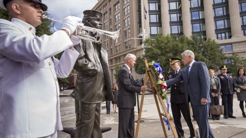 Defense Secretary Chuck Hagel, right, and Gen. Martin Dempsey, chairman of the Joint Chiefs of Staff, second from right, present a wreath at the Navy Memorial in Washington on September 17.