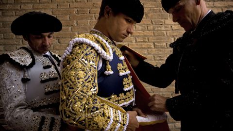 Matador Juan Bautista, center, prepares for a corrida, or bullfight, at the Granada bullring on June 6, 2010. 