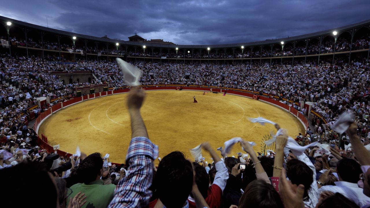 Want to channel your inner wanderer? Click through for some suggestions based on Anthony Bourdain's adventures. Up first: Bullfighting in Spain. Here, a Spanish matador greets the public during a bullfight in Granada.