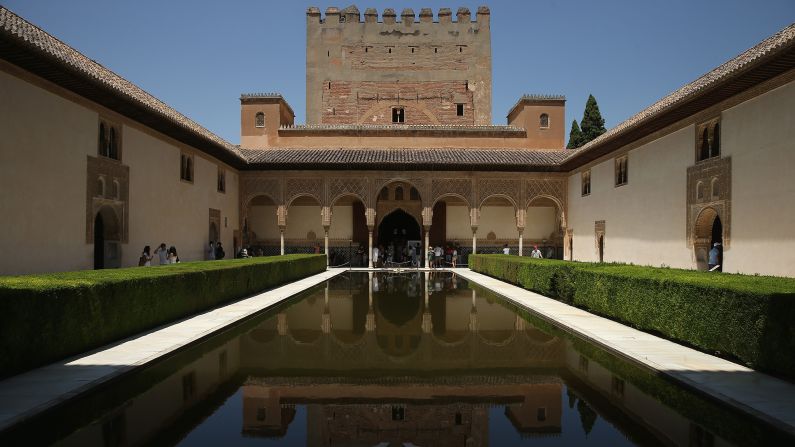 The reflecting pool in the Court of the Myrtles in the Nasrid Palaces at the Alhambra in Granada is a popular attraction.
