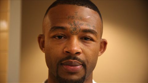 Marcus Dixon still has his face tattoos, but he now covers them with makeup.