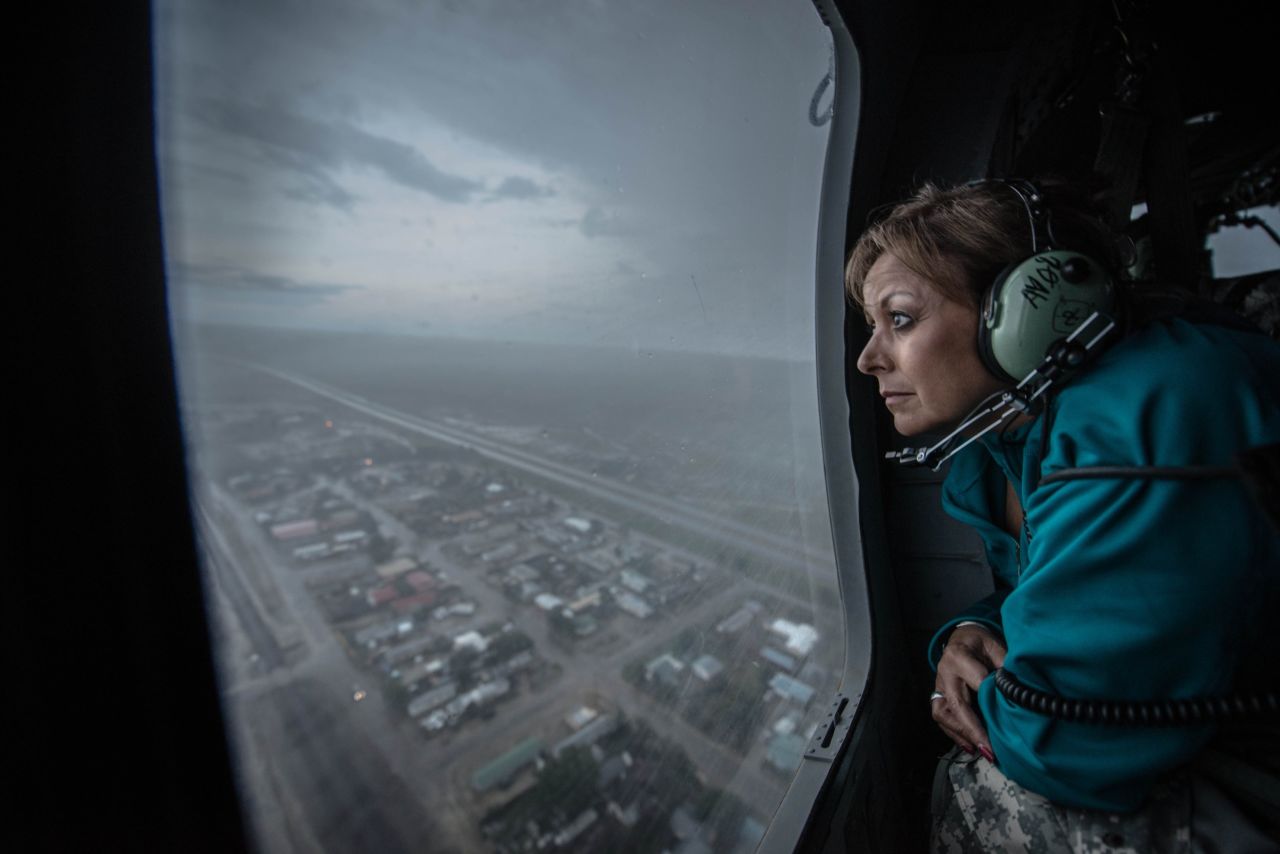 New Mexico Gov. Susana Martinez gets a bird's eye view of the city of Las Vegas from a Red Cross Blackhawk helicopter during a tour to assess the flood damage on Thursday, September 12.
