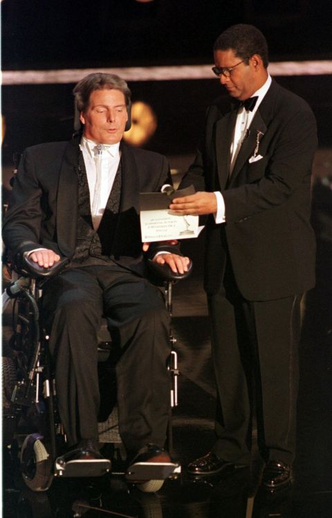Bryant Gumbel, right, hosted the 49th annual Emmy Awards in 1997 and has overwhelmingly been panned as one of the worst. Seen here helping the late actor Christopher Reeve read the winner for outstanding supporting actor for a miniseries or special, this was about as exciting as Gumbel's hosting duties got. 