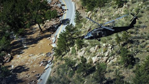 A Blackhawk helicopter flies over a canyon during a search around Boulder, Colorado, on September 17.