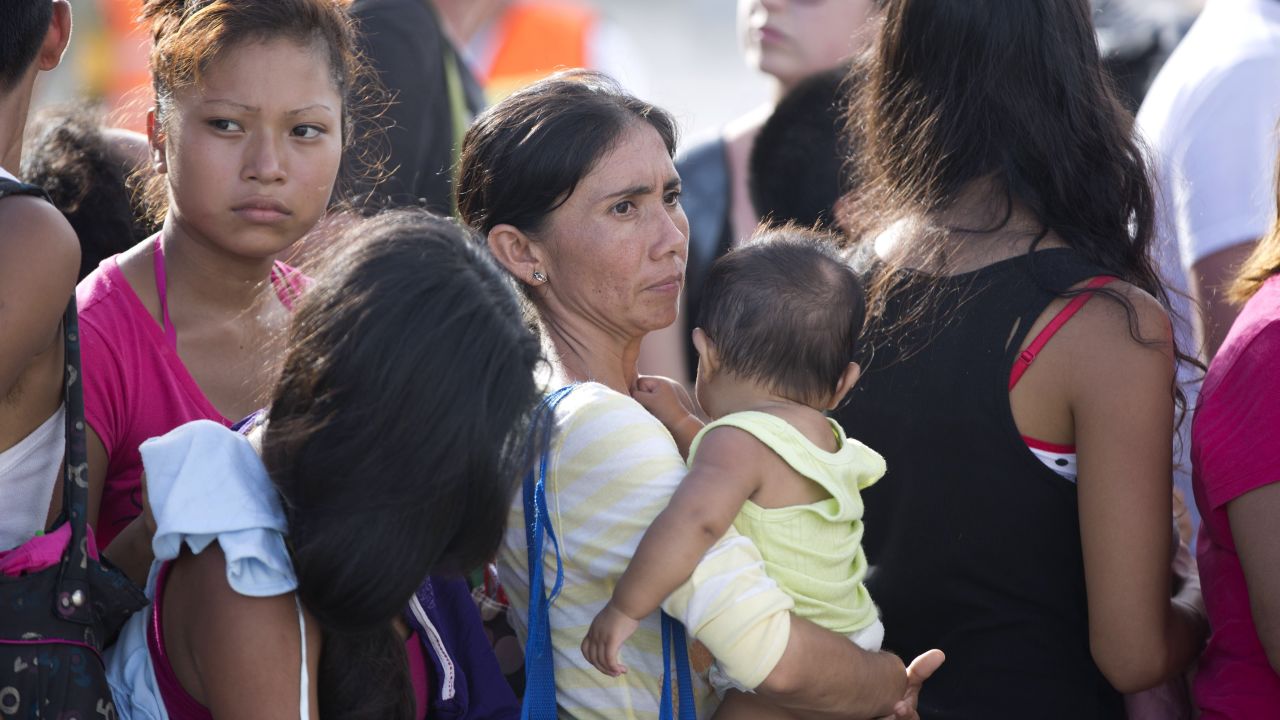 People wait in line at the air base on September 17.