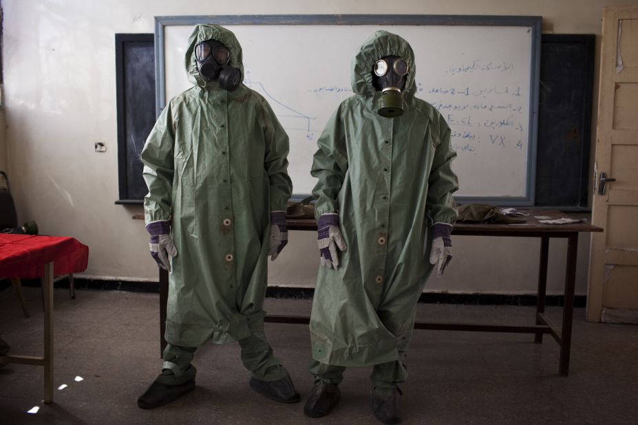 Volunteers wear protective gear to show a class how to respond to a chemical attack in Aleppo, Syria, on September 15. For two months, Mohammad Zayed, an Aleppo University student, has been training a group of 26 civilians to respond to a chemical attack.
