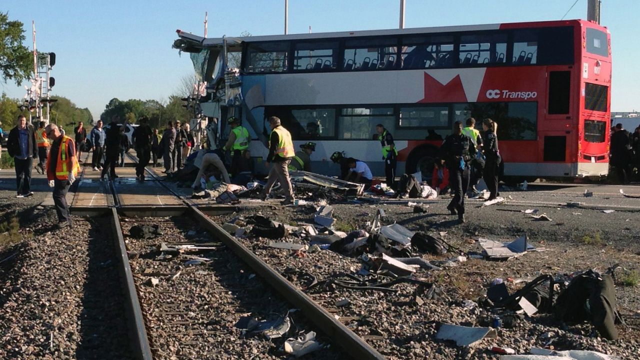 Officials respond to the scene in Ottawa on September 18.