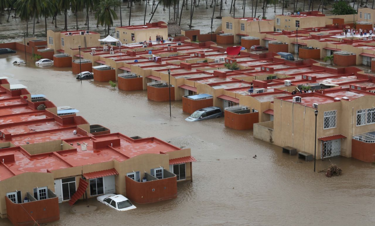 Homes and streets in Acapulco are deep in floodwater on September 17, after the heavy rain brought on by Tropical Storms Ingrid and Manuel.  