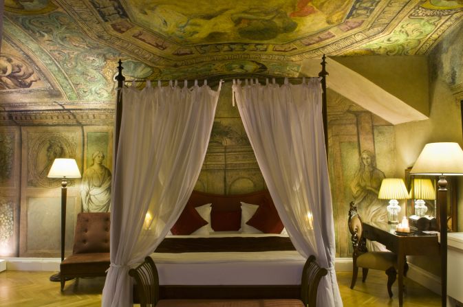Each of the hotel's 50 suites features frescoes along the ceilings, fireplaces in the corners, and four-poster beds. 