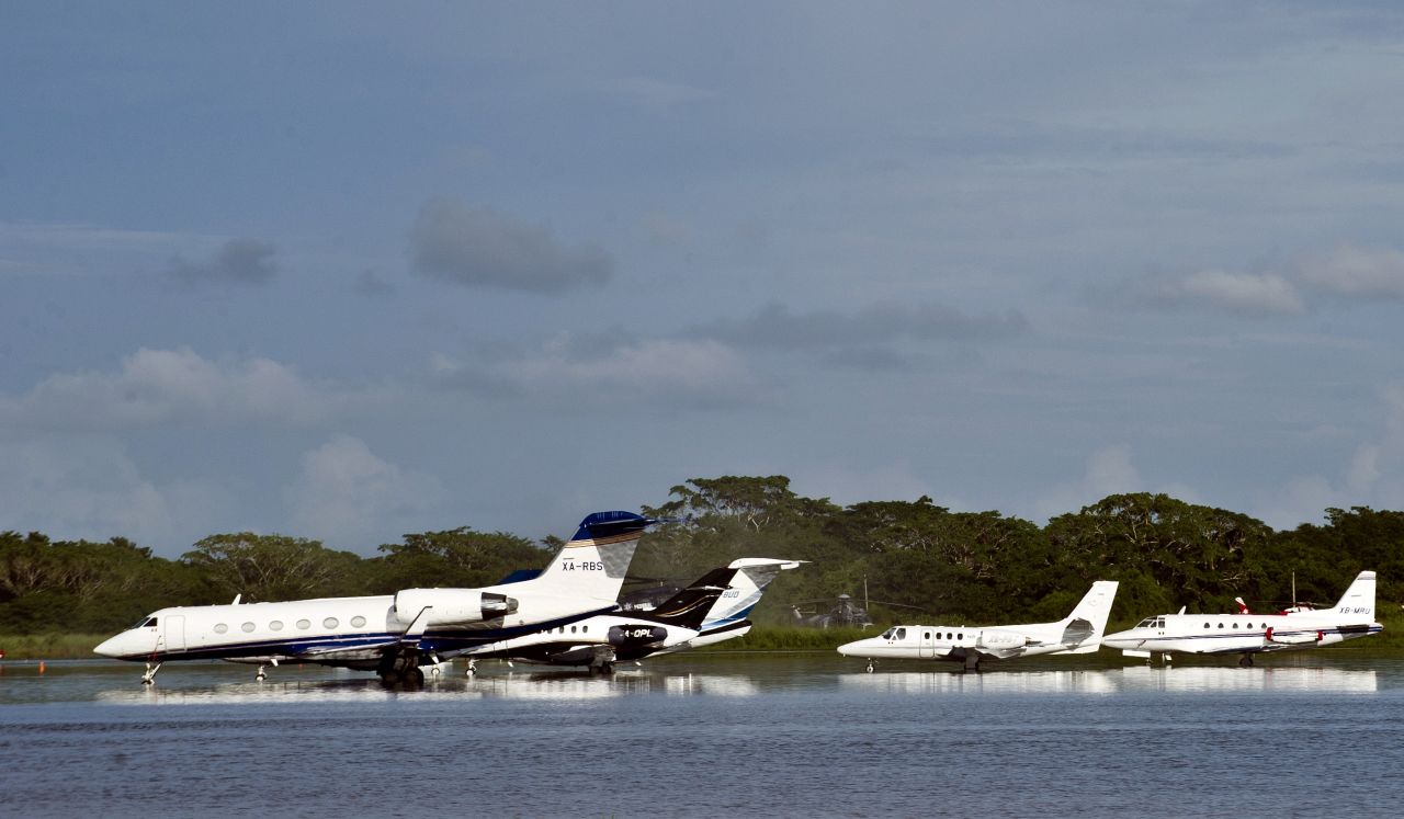 Planes sit on the flooded tarmac of the Acapulco airport on September 17.
