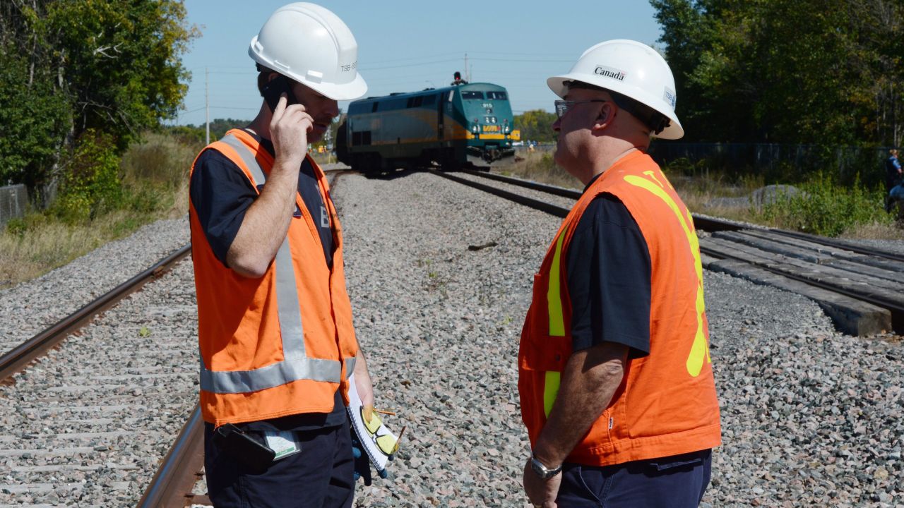 Transportation Safety Board of Canada officials work at the scene on September 18.