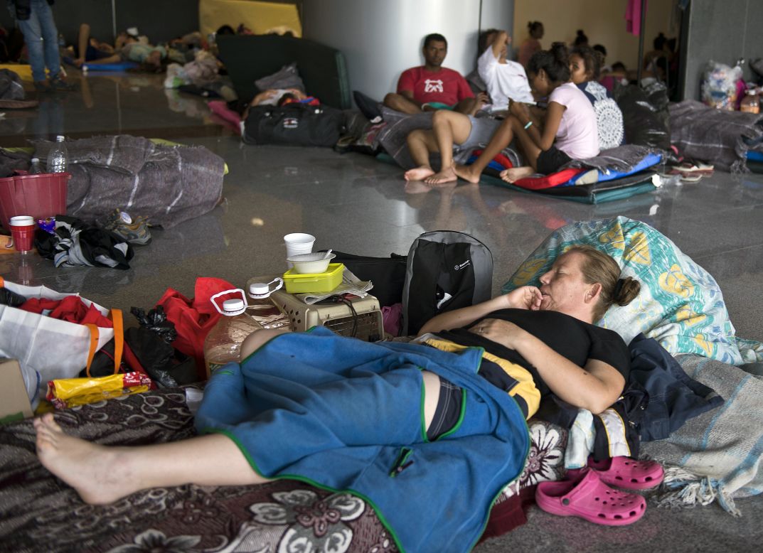 People rest in a shelter in Acapulco on September 17.
