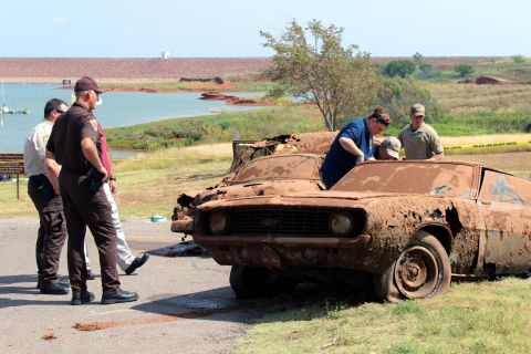 Sheriff's deputies found two cars submerged in Oklahoma's Foss Lake in September 2013, and DNA tests recently confirmed that the human remains inside those cars matched the descriptions of six people who went missing in 1969 and 1970. The state Medical Examiner's Office said the victims died from drowning and their deaths were accidental.