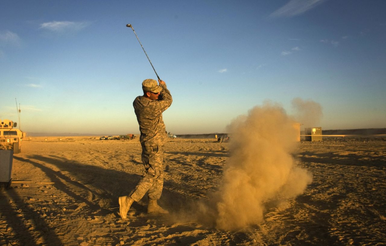 Not all extreme golfing venues are so formal. Here a US Army soldier hits a golf ball at his forward operating base in Paktika province, situated along the Afghan-Pakistan border.
