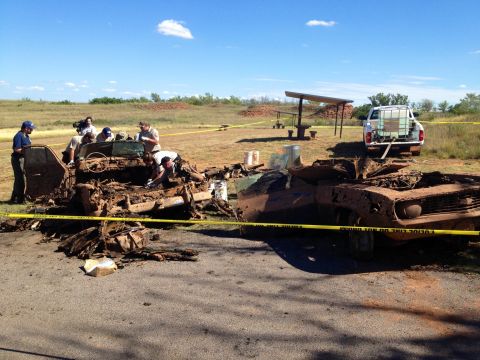 Investigators go through the vehicles in September 2013 to collect evidence as well as any human remains.