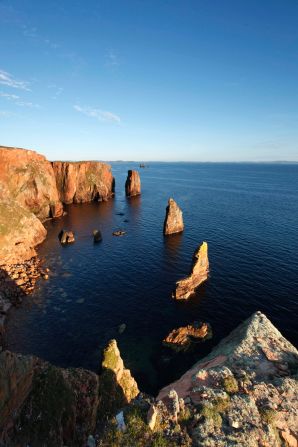 Yes, people do climb up Scotland's shard-like stacks.  One of the most challenging is the mean-sounding Old Man of Stoer.