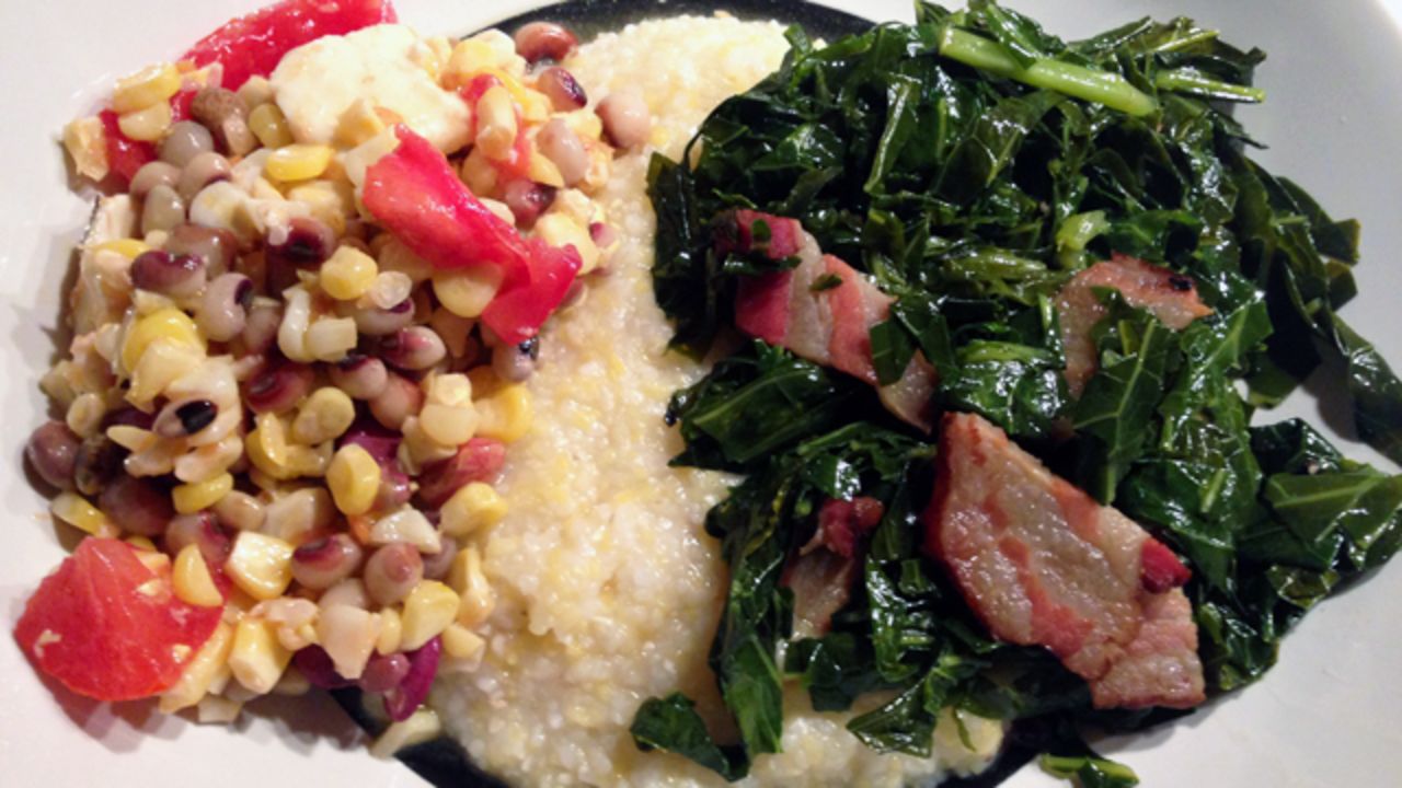 Dinner of Alabama grits, Tennessee bacon and New York corn, tomatoes, collards and beans. 