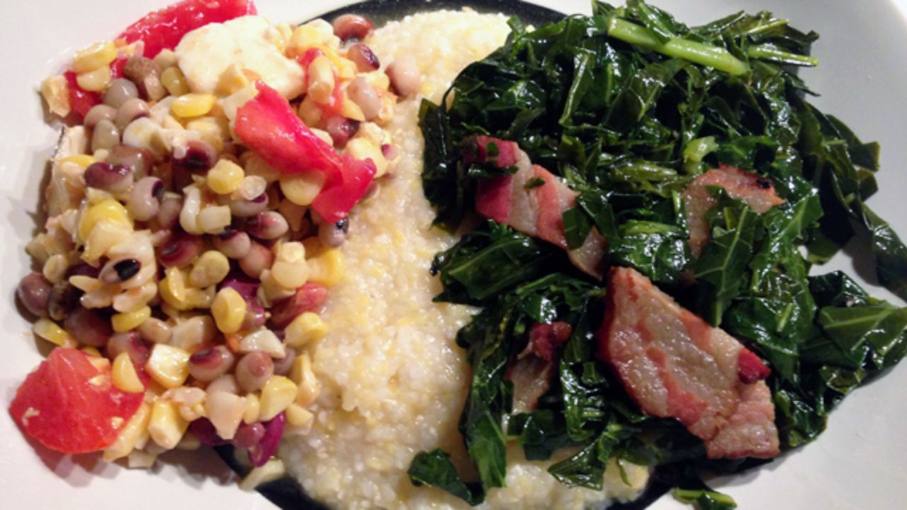 Dinner of Alabama grits, Tennessee bacon and New York corn, tomatoes, collards and beans.