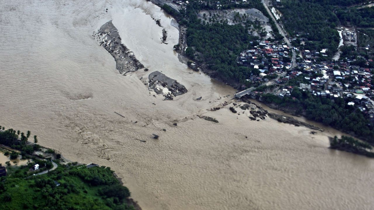 The Papagayo River swells with floodwaters in Acapulco on Tuesday, September 17.
