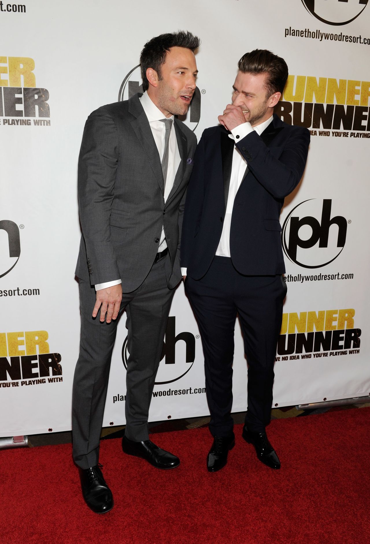 "Runner Runner" co-stars Ben Affleck and Justin Timberlake share a laugh at the premiere of their movie on September 18.