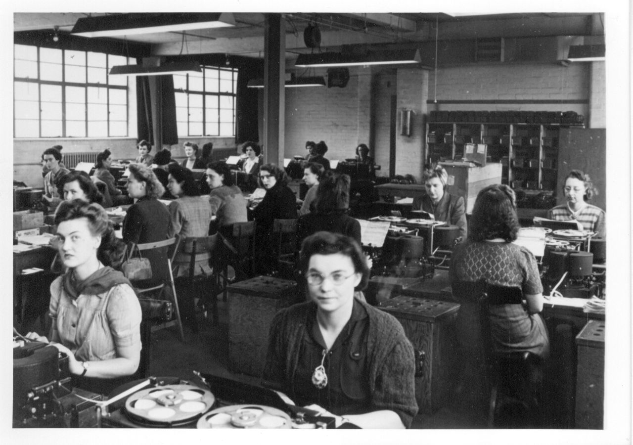 A number of Bletchley's former recruits now offer their services as guides for visitors at the Trust.