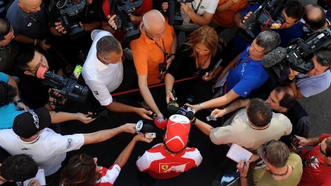 Ferrari driver Fernando Alonso faces the media in Singapore hungry to know what he makes of new team-mate Kimi Raikkonen.
