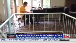 piano man plays in flooded colorado home nr brooke intv_00001122.jpg