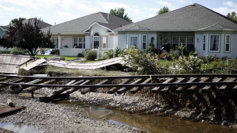 Railroad tracks washed from their path by floodwaters are seen in Longmont on Thursday, September 19, 2013. Massive flooding has left at least six people dead and damaged thousands of homes around the state.