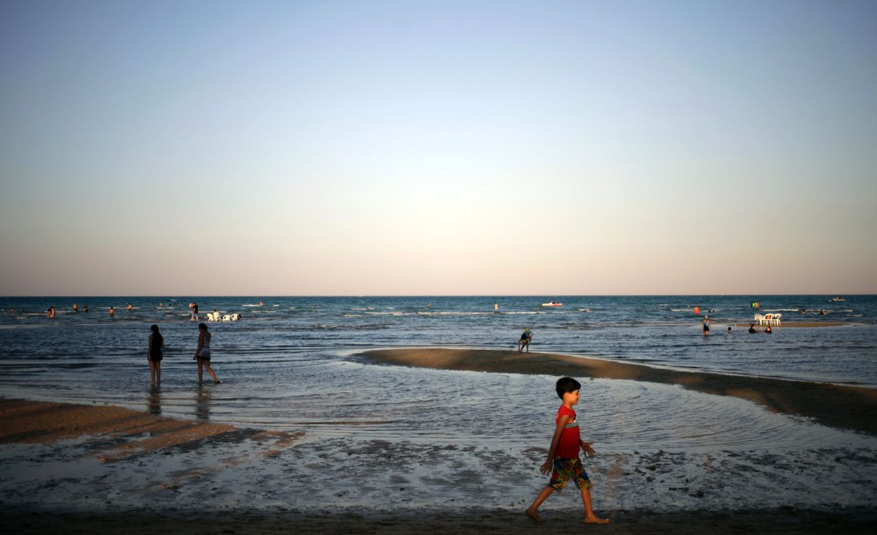People enjoy a summer day on the beach at Ain El-Sokhna resort on the Red Sea on September 16 in Cairo, Egypt.