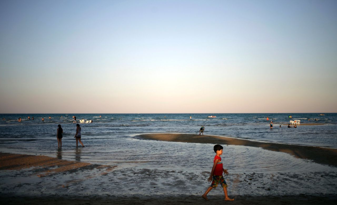 People enjoy a summer day on the beach at Ain El-Sokhna resort on the Red Sea on September 16 in Cairo, Egypt.
