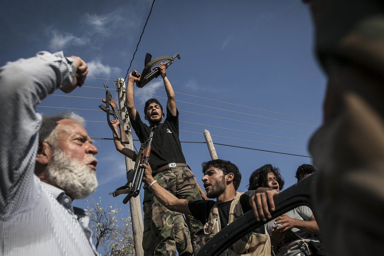 Opposition fighters react after returning from the battlefield in the Idlib province countryside on September 19.  