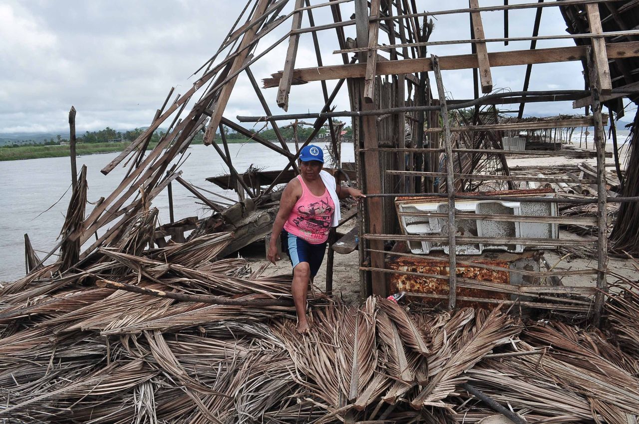 A resident of Barra de Coyuca checks the destruction in a restaurant by the beach in a tourist resort close to Acapulco, on Thursday, September 19. 
