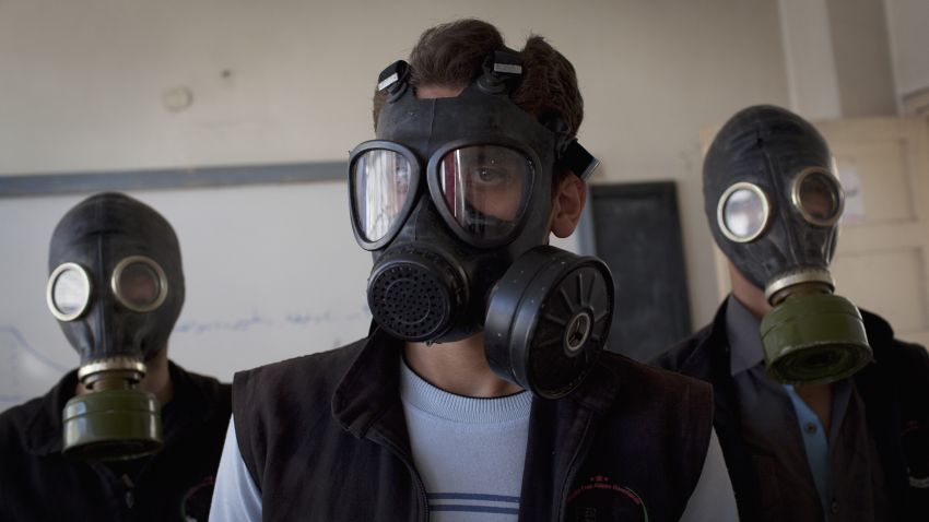 Volunteers wear gas masks during a class on how to respond to a chemical attack, in the northern Syrian city of Aleppo on September 15, 2013. For two months, Mohammad Zayed, an Aleppo University student, has been training a group of 26 civilians in the hope they can respond to a chemical attack.
