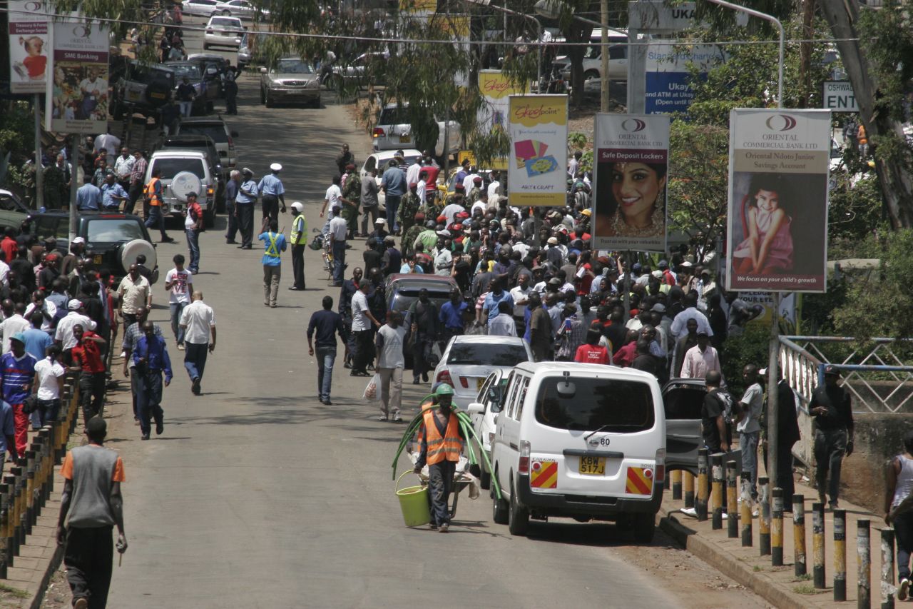 Crowds gather outside the upscale shopping mall. The interior ministry urges Kenyans to keep off the roads near the mall so police can ensure everyone inside has been evacuated to safety. 
