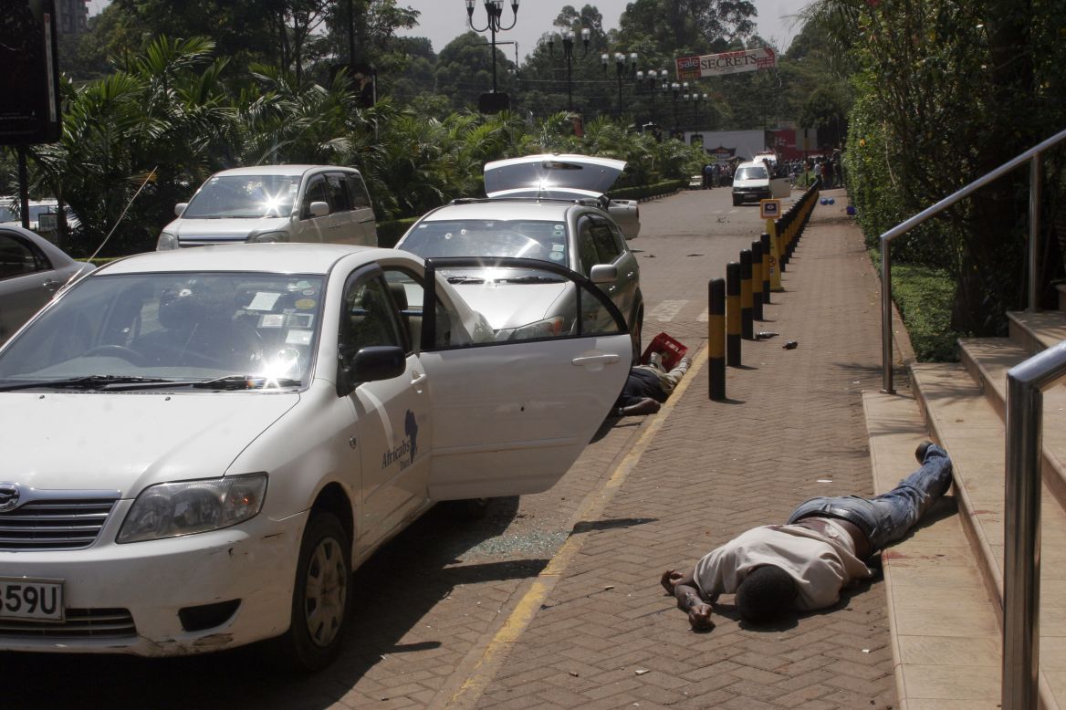 Bodies lie outside the shopping mall.