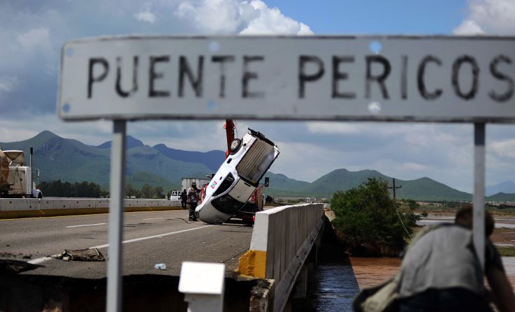 A van is recovered September 20, after being trapped by floodwaters in Navolato, Mexico.