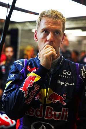 A pensive Sebastian Vettel waits to see if he has qualified in pole position for the Singapore Grand Prix at Marina Bay Street Circuit. 
