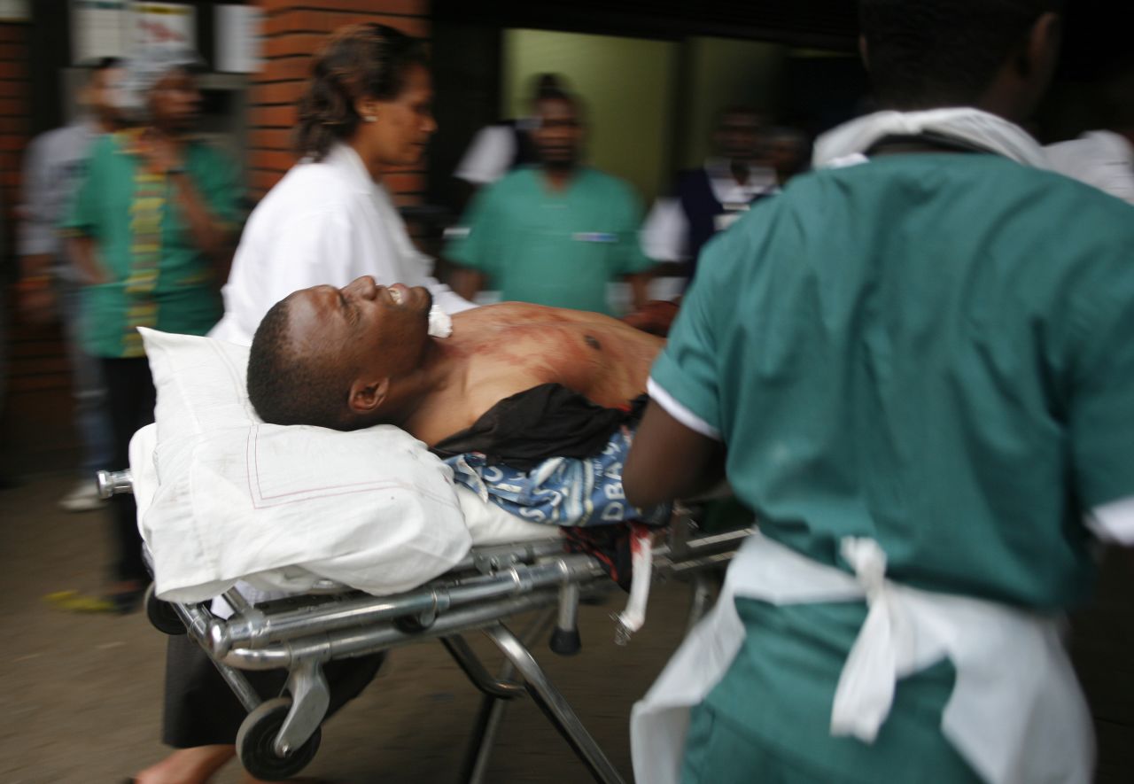 An injured man is wheeled into the Aga Khan Hospital in Nairobi.