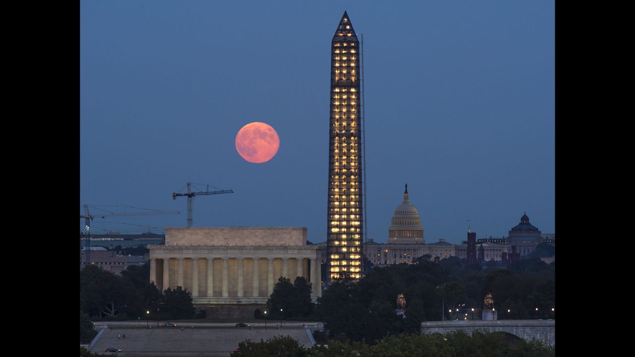 A harvest moon rises above the Lincoln Memorial, the Washington Monument and U.S. Capitol Building on September 19.