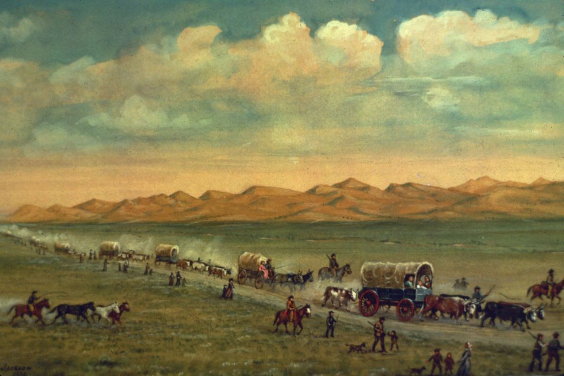 Painting by W.H. Jackson shows pioneers crossing the plains with the Sand Hills of Nebraska's Platte Valley in the background.  