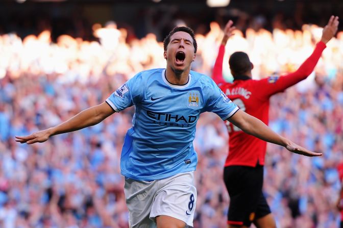 Nasri was criticized for his performance during City's 3-2 defeat in last season's home derby, but he played a key role in Sunday's 4-1 win. The France midfielder celebrates after scoring City's fourth goal.  