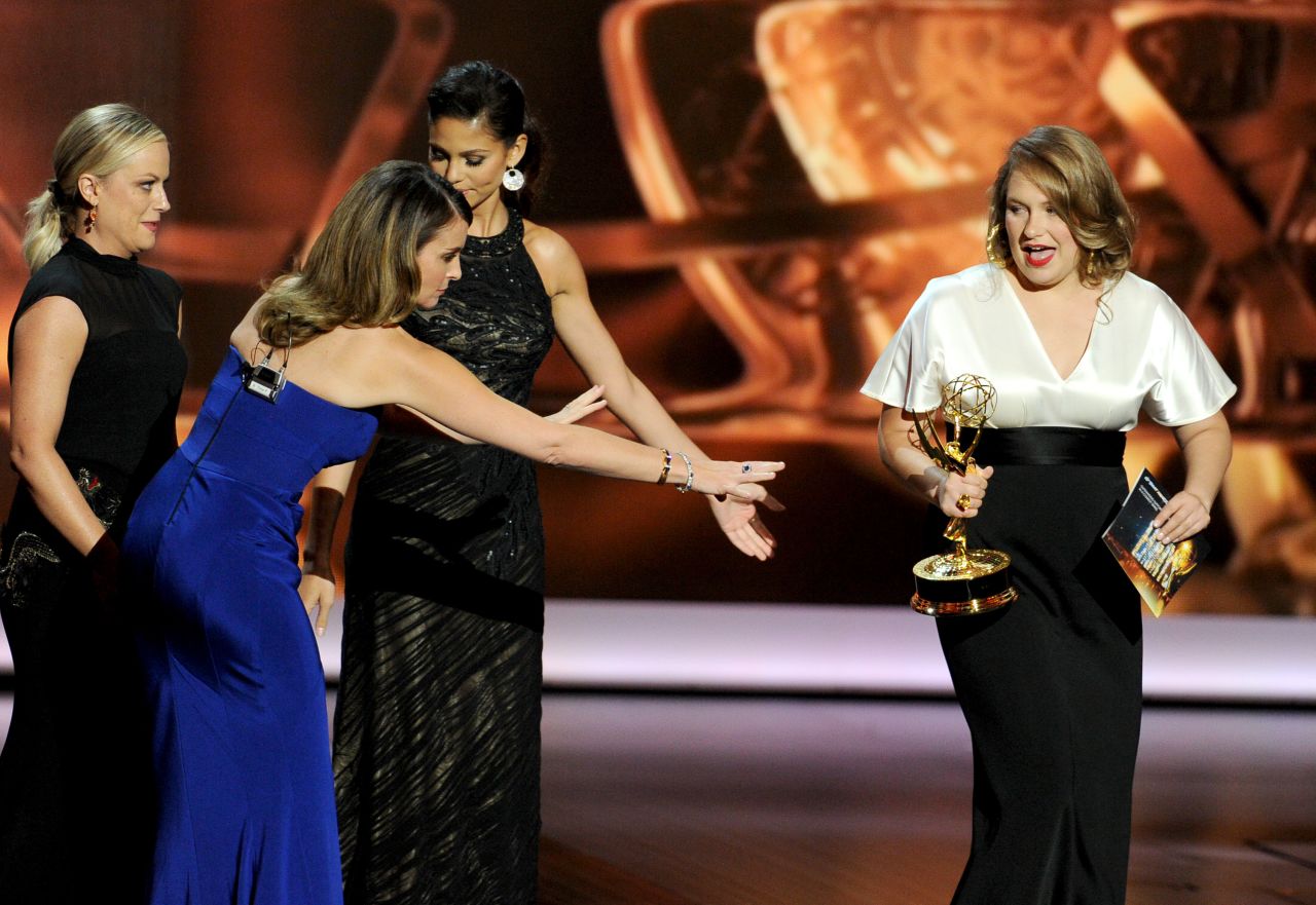 Merritt Wever of "Nurse Jackie," right, accepts the award for outstanding supporting actress in a comedy series.