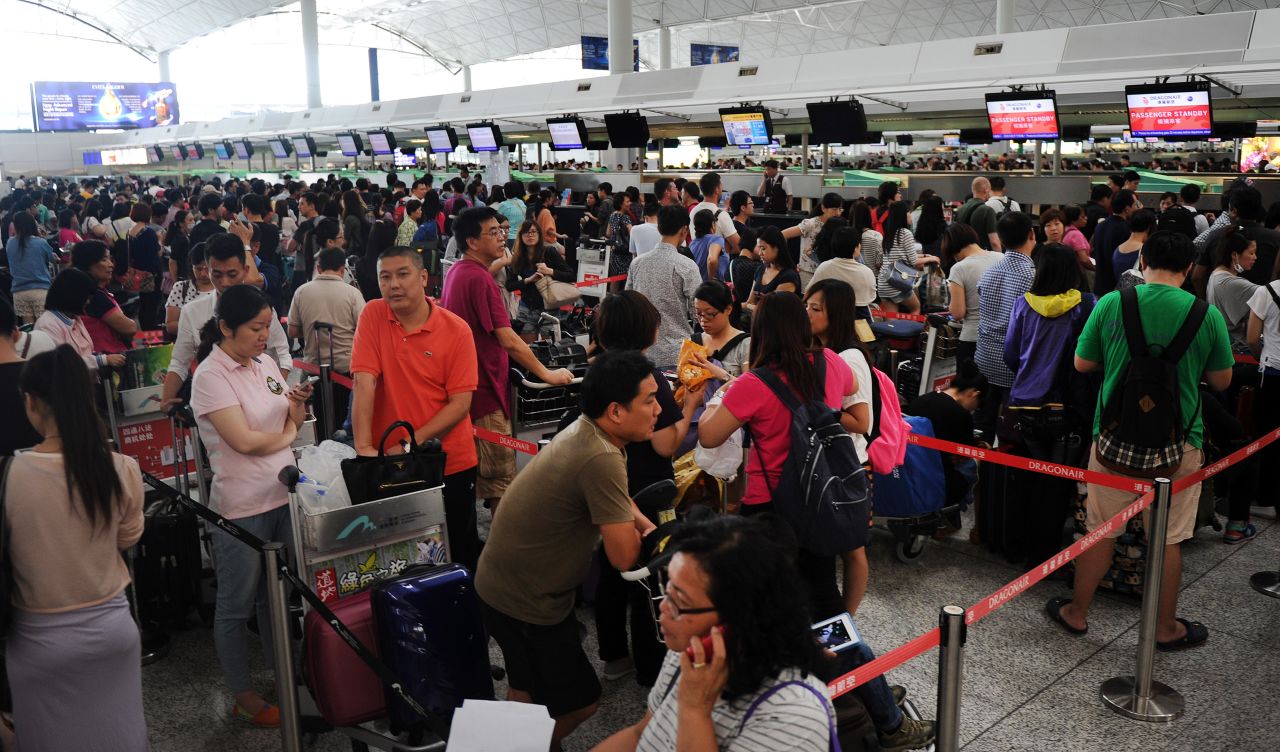 With thousands of passengers stranded, airlines and airport authorities were scrambling to deal with the backlog of flights at Hong Kong International Airport on September 22.