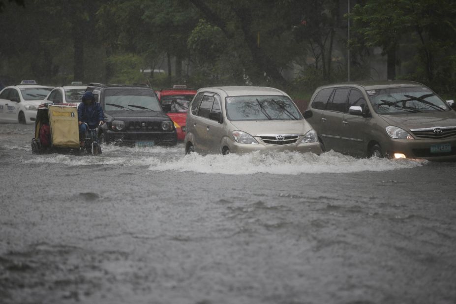 Typhoon Usagi floods streets in Manila, Philippines, as it sweeps through the Luzon Strait that separates the Philippines and Taiwan on September 22. 