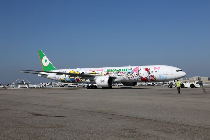 That is one eye-catching plane livery. The new Hello Kitty Boeing 777 themed "Sanrio Family hand-in-hand" has Hello Kitty and 18 other Sanrio characters all holding hands.