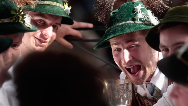 Beer drinkers laugh together in the Hacker-Pschorr tent at the festival on September 22.